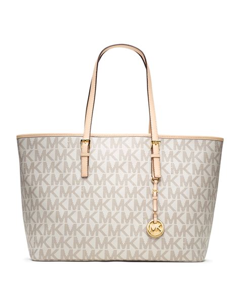 michael kors jet set travel logo tote bag|Michael Kors bag with airplanes.